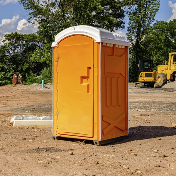 what is the cost difference between standard and deluxe portable restroom rentals in Caledonia County